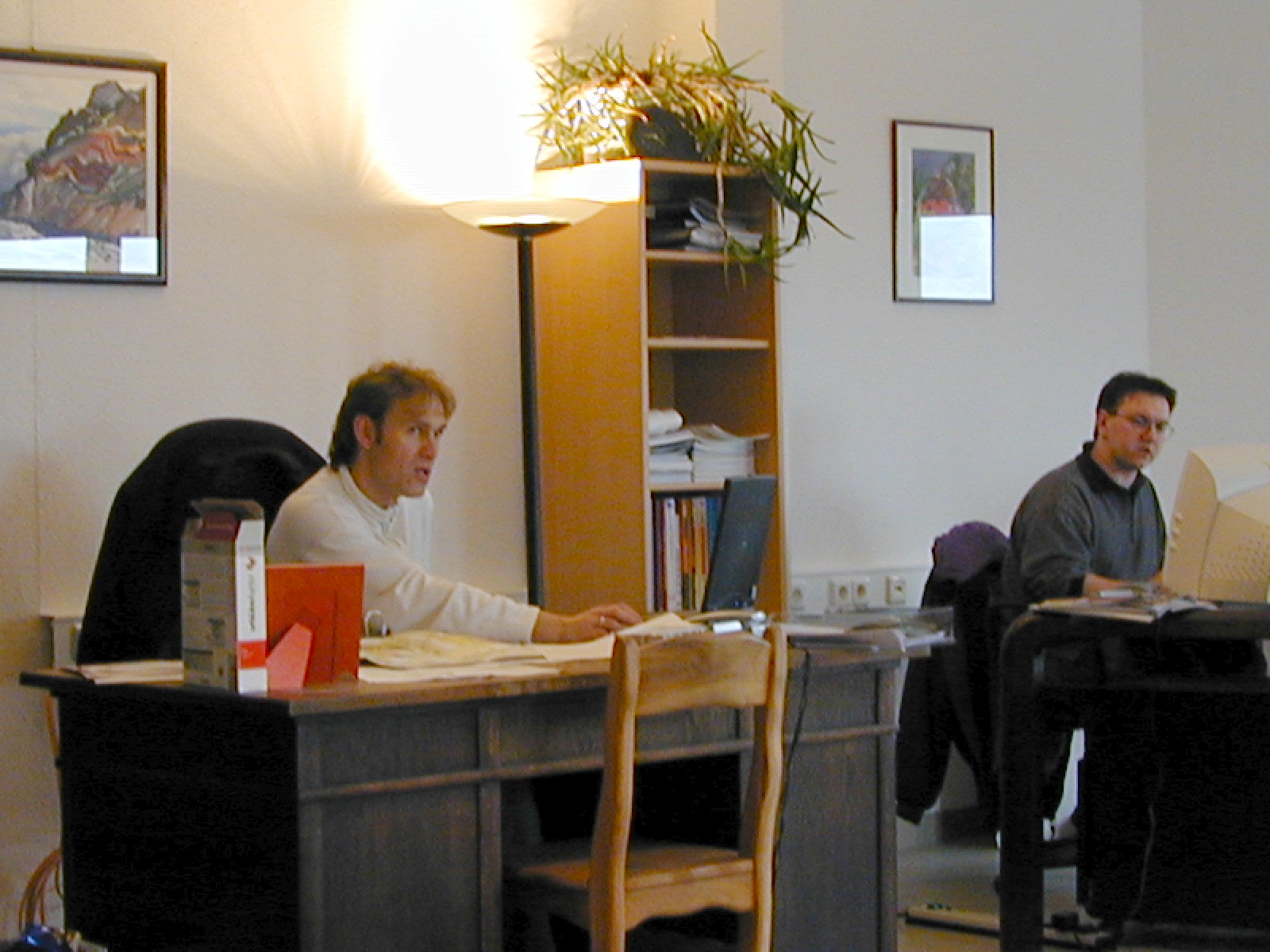 A photo from 1999 of Rainer Blanck and Pascal Miguet at their desks at work.