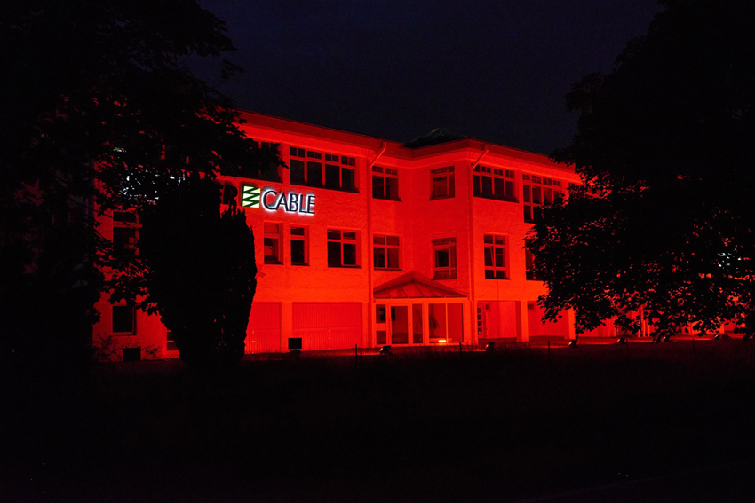 A picture of our company building at the “Night of Light”. It glows red in the dark.
